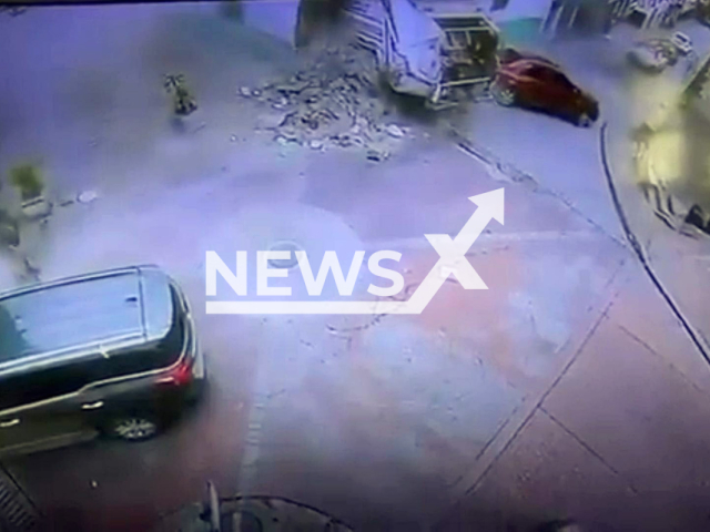 This image is a screen grab of the video supplied titled NewsX-TunMuns-01.mp4: Footage shows a garbage truck crashing into a historic house in Bogota, Columbia on Tuesday, Feb. 17, 2026.(Clipzilla)