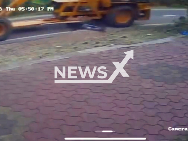 This image is a screen grab of the video supplied titled NewsX-CraneoPed-01.mp4: Footage shows man being run over by by a crane in Perampalli, Karnataka, India on Thursday, Feb.12, 2026.(Clipzilla)