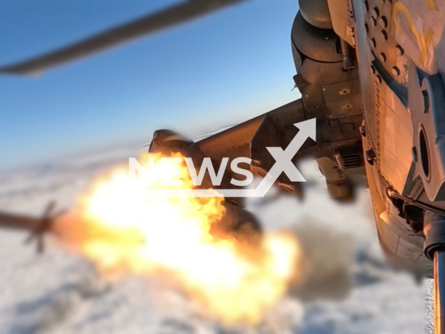 This image is a screen grab of the video supplied titled NewsX-ReconnoiteredStrike-01.mp4: Footage shows Russian Mi-28NM helicopter launching missiles at Ukrainian armoured vehicles, and a camouflaged UAV control points on the frontlines in Ukraine on Monday, Feb. 23, 2026.(Clipzilla)