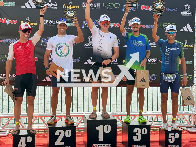 Race winner Gustavo Wiebbeling (centre) poses with Francisco Luiz Viana Neto (to his left) alongside other runner-ups. Francisco stopped before the finish line and let Gustavo cross it first after he realised there'd been a mistake during the "Veneno da Cobra Sprint Triathlon" in Cascavel, Brazil, on Sunday, 15 February 2026. Note: Private photo. (Francisco Luiz Viana Neto/Newsflash)