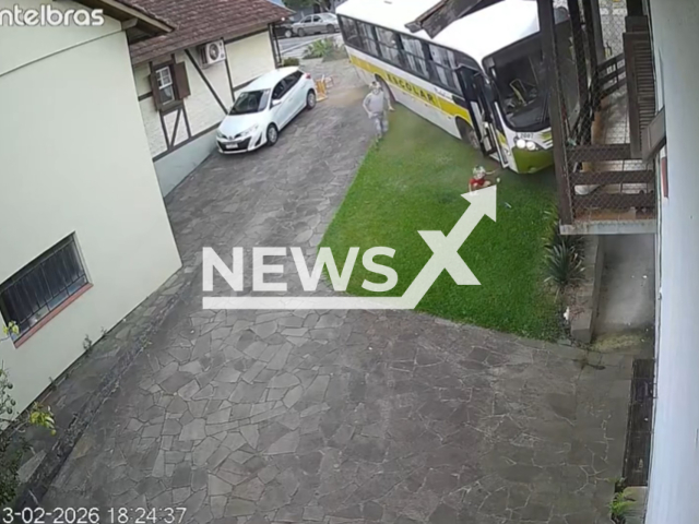 This image is a screen grab of the video supplied titled NewsX-SchoolCres-01.mp4: Footage shows out-of-control school bus hitting two cars and a house in Nova Petropolis , in Serra Gaucha, Brazil on Friday, Feb. 13, 2026.(Clipzilla)
