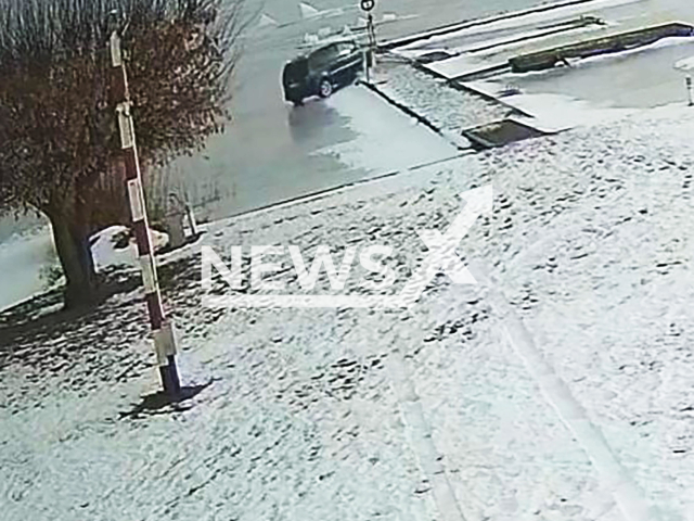 This image is a screen grab of the video supplied titled NewsX-IceRide-01.mp4: Footage shows car driving onto the frozen lake surface and then crashing into a jetty belonging to the Water Rescue Service in Zegrze Reservoir, Poland on Monday, Feb. 16, 2026.(Clipzilla)