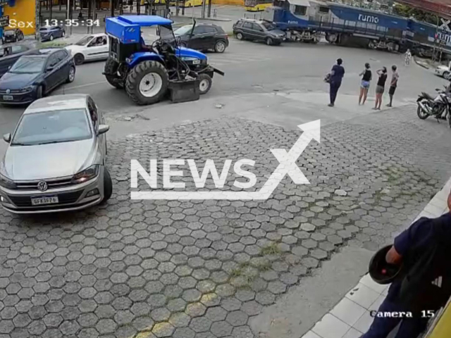 This image is a screen grab of the video supplied titled NewsX-LedieTrein-01.mp4: Footage shows driver abandons the car seconds before the vehicle was hit and dragged by a train in Joinville, Santa Catarina, Brazil on Friday, Feb. 20, 2026.(Clipzilla)