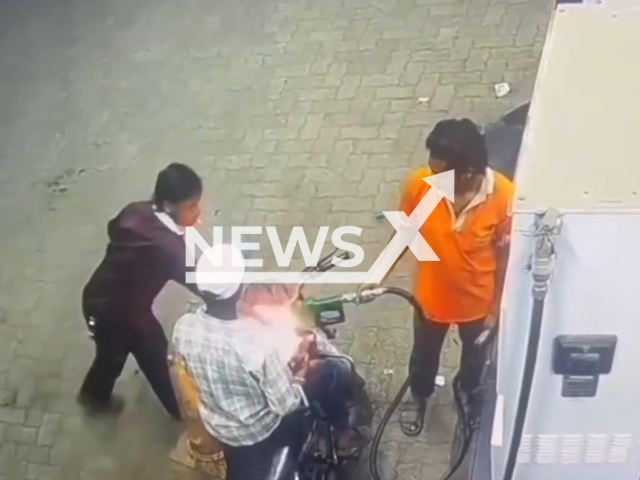 This image is a screen grab of the video supplied titled NewsX-InfernoPump-01.mp4: Footage shows a man lighting a cigarette while refuelling at a petrol pump sparking a sudden fire that engulfed his motorcycle’s tank and nozzle, but alert staff quickly extinguished the blaze and prevented a major disaster in Raipur, India on Wednesday, Feb. 18, 2026.(Clipzilla)