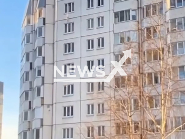 This image is a screen grab of the video supplied titled NewsX-JacketSave-01.mp4: Footage shows man with stretched-out jacket saves a child felling from 10th floor of a high-rise building in St. Petersburg, Russia on Thursday, Feb. 26. 2026.(Clipzilla)