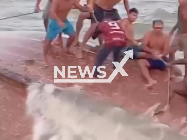 The crew of another boat rescues fishermen stranded in the sea in Para, Brazil, undated. Their fishing boat began to sink. Note: Photo is a screenshot from the video (Newsflash)