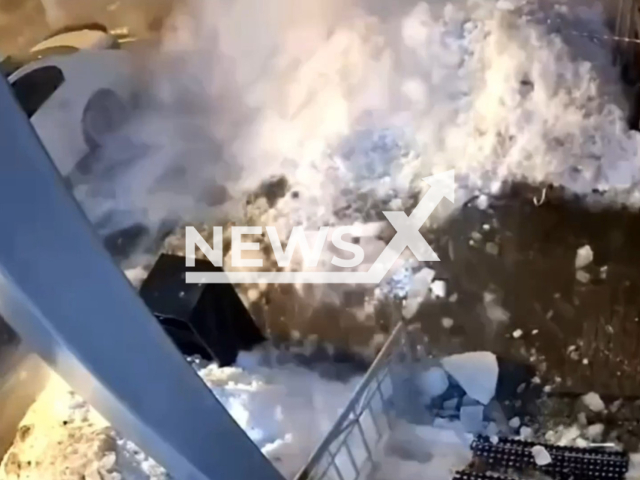 This image is a screen grab of the video supplied titled NewsX-RoofSnowfall-01.mp4: Footage shows a massive roof snowfall crushing parked cars in Zvenigorod, Moscow Oblast, Russia on Monday, Mar. 2, 2026.(Clipzilla)