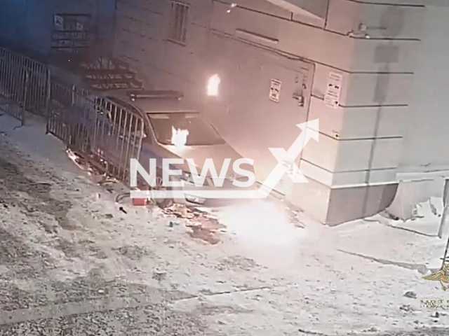 This image is a screen grab of the video supplied titled NewsX-PoliceCarFire-01.mp4: Footage shows 19-year-old setting police vehicle on fire in Moscow, Russia on Friday, Feb. 20, 2026.(Clipzilla)