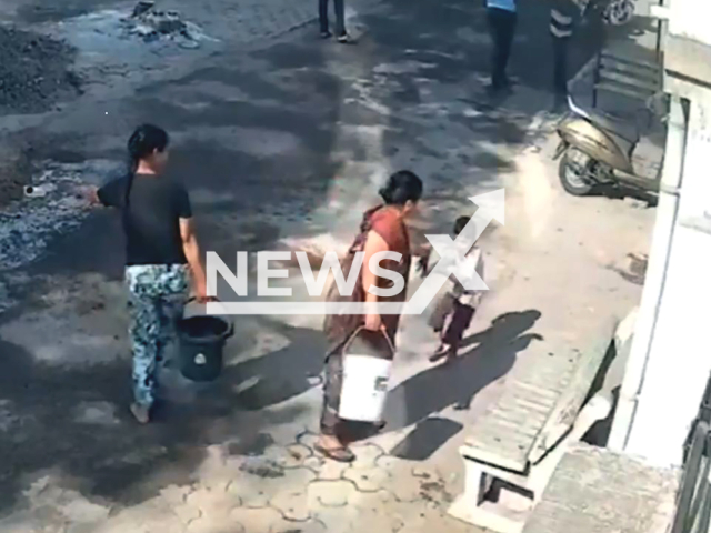 A woman pours hot water on a four-year-old boy in Nagpur, India, on Mar.03,2026. He suffered 45 per cent burns. Note: Photo is a screenshot from a video. (Newsflash)