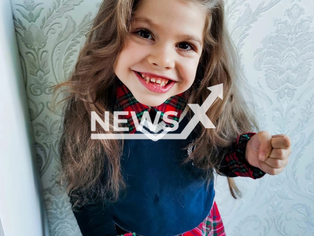 "Russia's most beautiful girl" Ksenia Nikitina poses in undated photo. She died at age 8 from an incurable genetic disease. Note: Private photo. (Newsflash)