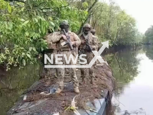 This image is a screen grab of the video supplied titled NewsX-NarcoSubmersible-01.mp4: Footage shows troops standing on seized the vessel in a nature reserve near the Colombian border in Ecuador, undated. The Ministry of National Defense of Ecuador released the footage on Wednesday, Mar. 4, 2026.(Clipzilla)