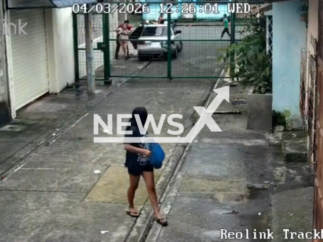 This image is a screen grab of the video supplied titled NewsX-WomanAbducted-01.mp4: Footage shows a woman being forcibly abducted by several men outside her home as neighbors rush to help, with one man even climbing onto the back of the getaway car as it speeds away in southern Guayaquil, Ecuador on Wednesday, Mar. 4, 2026.(Clipzilla)