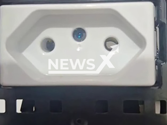 Picture shows the microcamera that was hidden in a toilet in Icara, Brazil, undated. It was seized by the police. Note: Police photo. (@pmicara/Newsflash)
