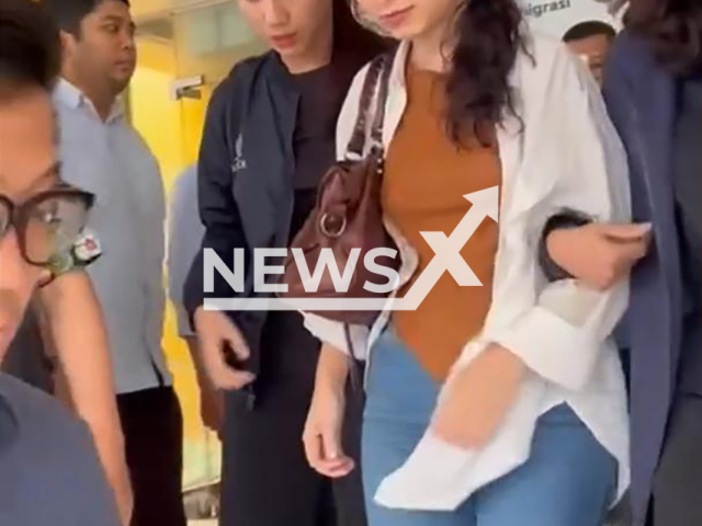 Police arrests Mariana Fonseca, sentenced to 23 years in prison for the murder of Diogo Goncalves as an accomplice, undated video. The murder occurred in Algarve in 2020. Note: Photo is a screenshot from a video. (@divhubinterpolriofficial/Newsflash)