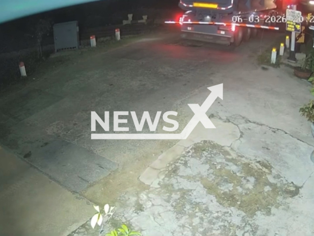 Footage shows a tractor-trailer attempting to cross a railway barrier before being struck by the SE8 passenger train at a level crossing splitting the truck in two in An Dai 3 village, Ve Giang commune, Quang Ngai Province, Vietnam on Friday, Mar. 6, 2026.(Clipzilla)