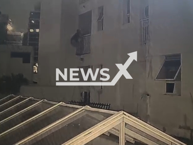 This image is a screen grab of the video supplied titled NewsX-PoliceThif-01.mp4: Footage shows a suspect known as 'Spider-Man' for scaling buildings to break into apartments, who was later arrested by police following a burglary investigation in Sao Paulo, Brazil on Wednesday, Mar. 11, 2026.(Clipzilla)