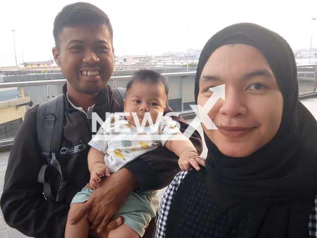 Picture shows Mohd Syafaeez with baby, Hayl Haarith and his wife, Ummu Habibah, undated. The baby died while under the care of a childcare centre in Seberang Jaya, Malaysia. Note: Private photo. (Newsflash)