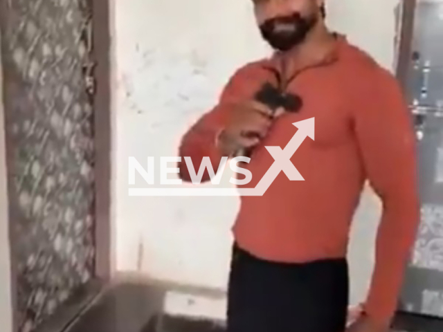 Man accidentally shoots himself in the chest while loading gun while his cousing filmed the incident in Delhi, India, March 16, 2026. The cousin was arrested. Note: Photo is a screenshot from the video (Newsflash)