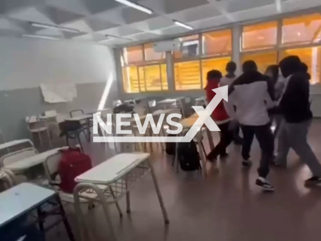 Video shows students throwing flares in a classroom in San Isidro, Argentina, undated. They risked causing fire or injuries. Note: Photo is a screenshot from the video (Newsflash)
