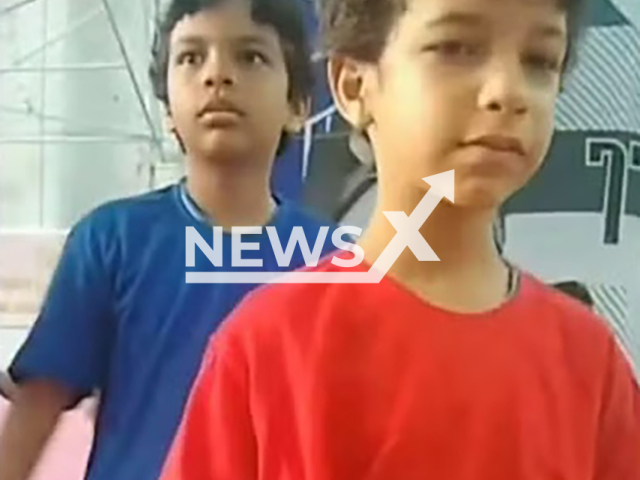 Brothers Rodrigo Magalhaes de Lira Junior, 11, and Antonio Emanuel de Paula Magalhaes, 9, pose in undated photo. They died while trying to escape fire in Recife, Brazil. Note: Private photo. (Newsflash)