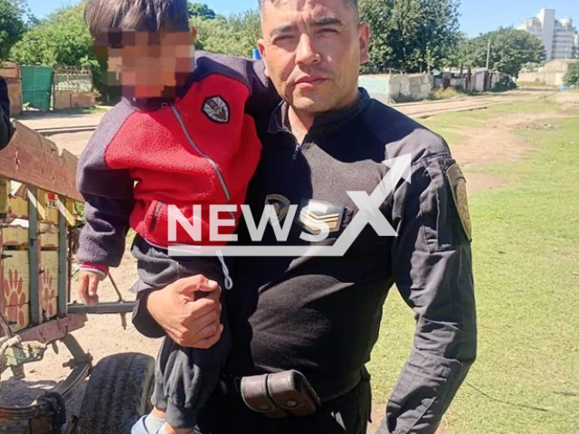 Picture shows Pablo Luna with the boy he saved, undated. He saved a child who was on the train tracks seconds before a freight train passed in Cordoba, Argentina. Note: Private photo. (Newsflash)
