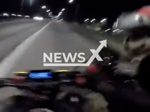 Video shows a motorcyclist being robbed while traveling at 100 kilometers per hour on a highway near Villa Dominico, Argentina, undated. Note: Photo is a screenshot from a video. (Newsflash)