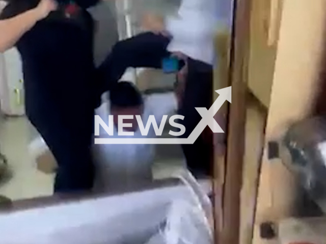Video shows brawl inside a funeral home in Nova Serrana, Brazil, March 30, 2026. According to the police, the argument began after the family was informed that the funeral plan they had contracted did not cover a larger urn, requiring an additional payment. Note: Photo is a screenshot from a video. (Newsflash)