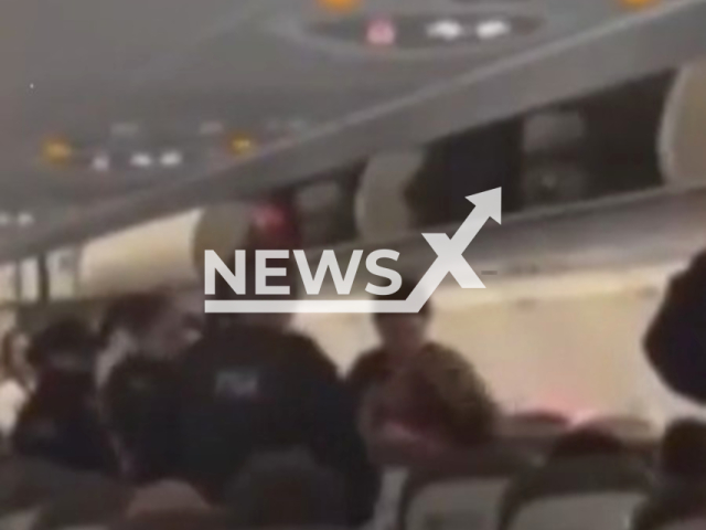A woman is arrested on an plane after biting a member of airport security, on Tuesday, June 2, in Buenos Aires, Argentina. She refused to pay for extra baggage and boarded the plane without permission. Note: Picture is a screenshot from video. (Newsflash/NX)