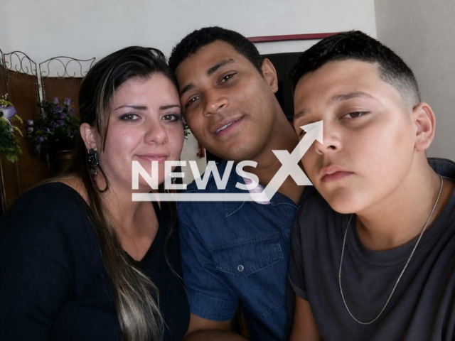 Jessica de Jesus Hass, 32, and husband Rafael Moreira do Amaral, 37, pose with Matheus Souza do Amaral, 15, in undated photo. They were  shot and killed Jhonatan Sales dos Santos,  32, by mistake.    Note: Private picture. (Newsflash/NX)