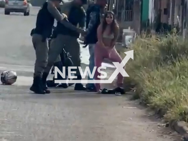 Woman pulls loaded pistol from vagina during police intervention in Cidade Ocidental, Brazil, June 11, 2026. Note: Photo is a screenshot from a video. (Newsflash/NX)
