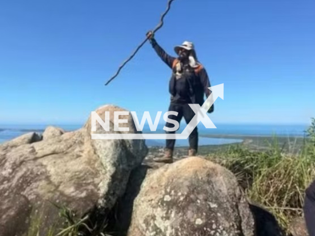 Caio Rocha Aguiar Arrabal, 44, poses in photo at the summit of Pedra do Macaco in Marica, Brazil.  He fell and died from the injuries.  Note: Private picture. (Newsflash/NX)