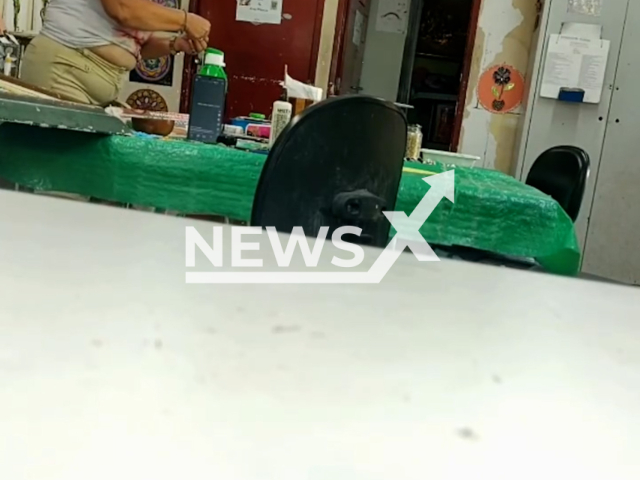 Maria Aparecida Rodrigues de Arauj allegedly puts poison in teachers bottle in  Recife, Brazil. The teacher Denny Cardoso became suspicious after noticing bubbles in the water. Note: Photo is a screenshot from a video. (Newsflash/NX)