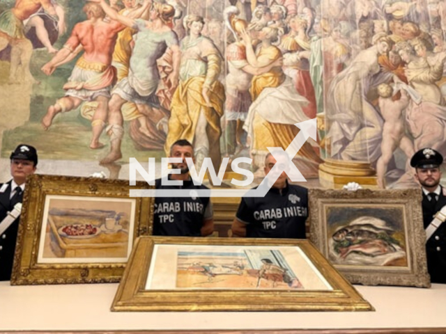 Picture shows police with the stolen paintings, undated. They recovered the stolen paintings. Note: Police photo. (Carabinieri/Newsflash/NX)