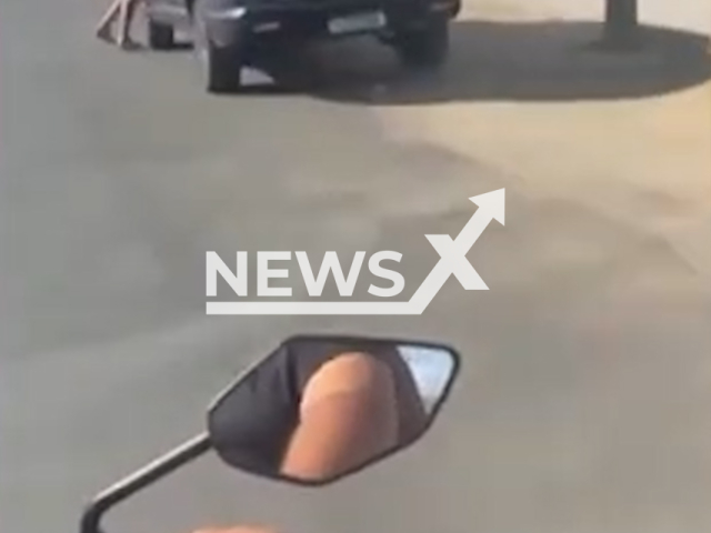Woman is dragged by ex-partner in vehicle in Sobral, Brazil. The driver was arrested by police.  Note: Photo is a screenshot from a video. (Harrisons)