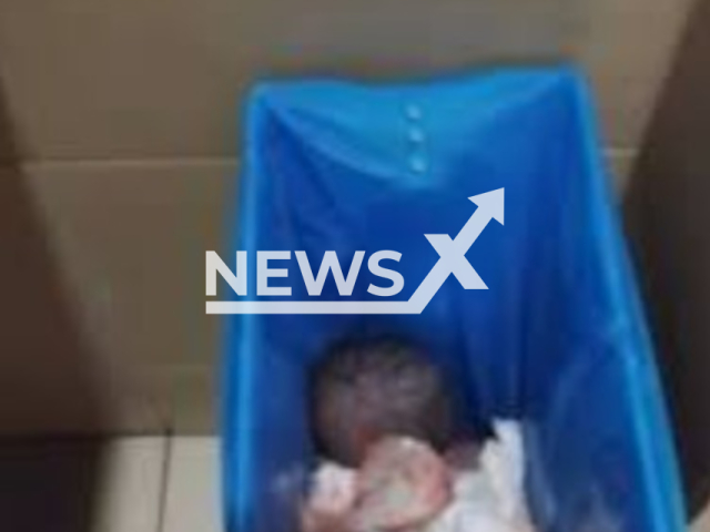 Picture shows a newborn baby found alive in  toilet bin at  Penang International Airport, in Bayan Lepas, Malaysia. Two people were arrested. Note: Photo is a screenshot from a video. (Harrisons)