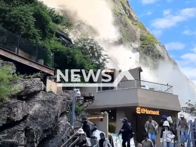 Tourists flee during  landslide at scenic area in Diqing Tibetan Autonomous Prefecture, China. No one was injured. Note: Photo is a screenshot from a video. (Harrisons)
