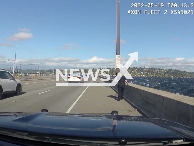 Officers from SPD's Harbor Unit rescued a group of boaters Wednesday after waves and high-winds pushed them under the I-90 bridge, in Seattle, Washington, on May 18, 2022. Note: Picture is a screenshot from a video (Seattle Police Department/Clipzilla)