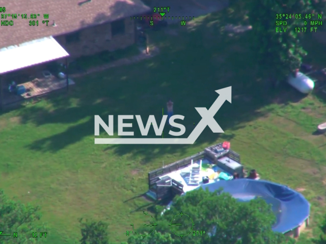 Mr. Solomon pointing a gun at the police helicopter at at 15405 Haley Dr. in far southeast Oklahoma City, on the 13th of May. Note: This picture is a screenshot from the video. (Oklahoma City Police Department/Clipzilla)