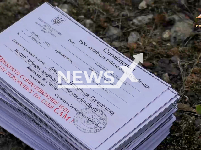 The Peoples Militia of DPR is using methods like sending leaflets of the appropriate content with help of drone.  Words on paper: Death Certificate. Stop resisting or fill out your death note. Note: This picture is a screenshot from the video.  (People's Militia of DPR/Newsflash)