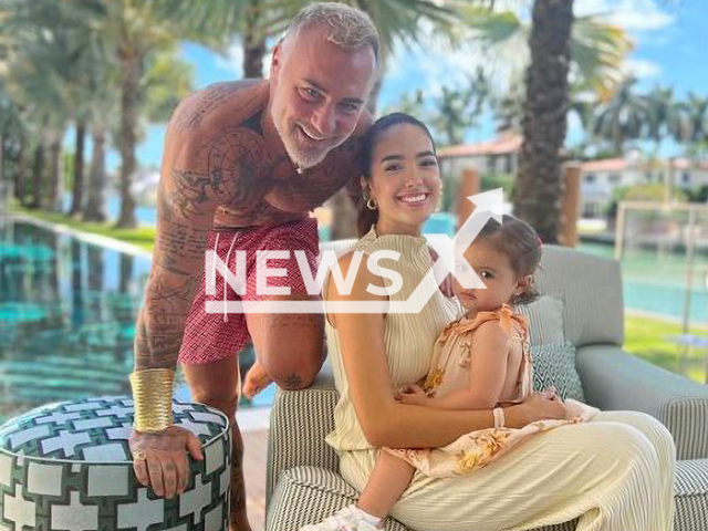 Gianluca Vacchi, 54, with his partner Sharon Fonseca and daughter Blu Jerusalema Vacchi. Note: Private photo.  (@gianlucavacchi/Newsflash)