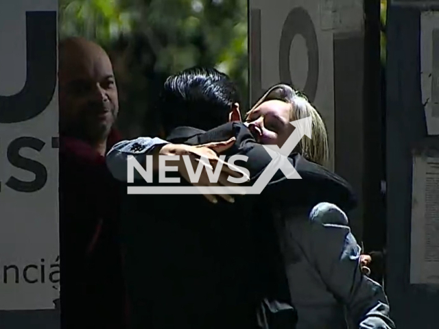 Elize Matsunaga, pictured with her lawyer Luciano de Freitas Santoro, when she  was released on parole in May, 2022, in Brazil, she was convicted and imprisoned 10 years ago for killing and dismembering her husband, Marcos Matsunaga, in 2012. Note: Photo is a screenshot from a video. (Newsflash)