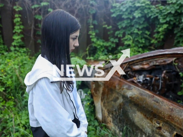 Daria, 13, who pretended to be dead after soldiers from Russian Federation allegedly killed her parents in Kyiv, Ukraine, shows the place of the incident and her home. Note: Picture is a screenshot from a video (NEBYTOV/Newsflash)