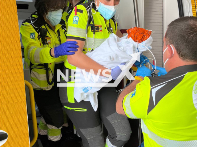 Woman found a newborn baby wrapped in a blanket in Aluche, Madrid in June 2022. Note: Licensed photo(@EmergenciasMad/Newsflash).