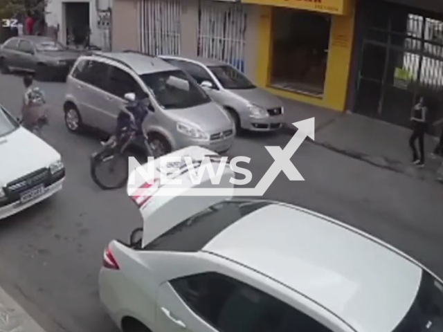 A 14-year-old teenager riding a bicycle on the street, lost his balance when dodging a pedestrian and fell, was hit by a car and dragged under the car down the street, in Ipatinga, Brazil, on 28th May. Note: Picture is a screenshot from a video (Newsflash)