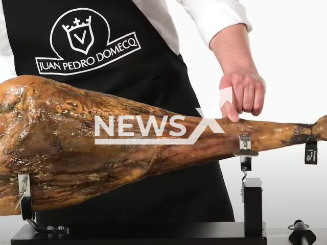 A leg of ham, a waiter was saved from a shooting in Madrid , Spain, in June, 2022, when the bullets landed in one. Note: Photo is a screenshot from a video. (Newsflash)