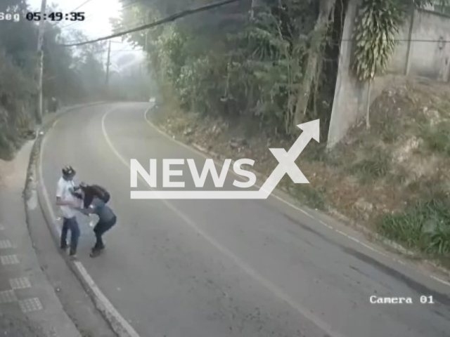 Man tries to rob a woman walking down the road and is assaulted by passengers who saw crime on a bus, on 6th June, in Itabira, Brazil. Note: Picture is a screenshot from a video (Newsflash)