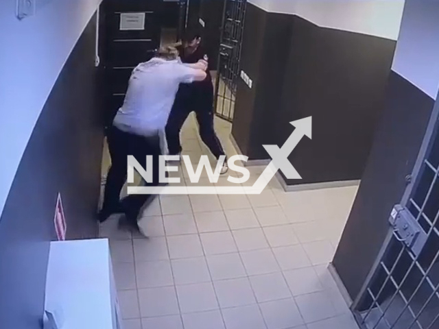 Ivan Kostyukov, 48, attacked Vitaly Klimanov, 33, a police officer in the building of the Proletarsky District Court of Rostov-on-Don in Russia on 8th June 2022. Note: Picture is a screenshot from a video (Newsflash)