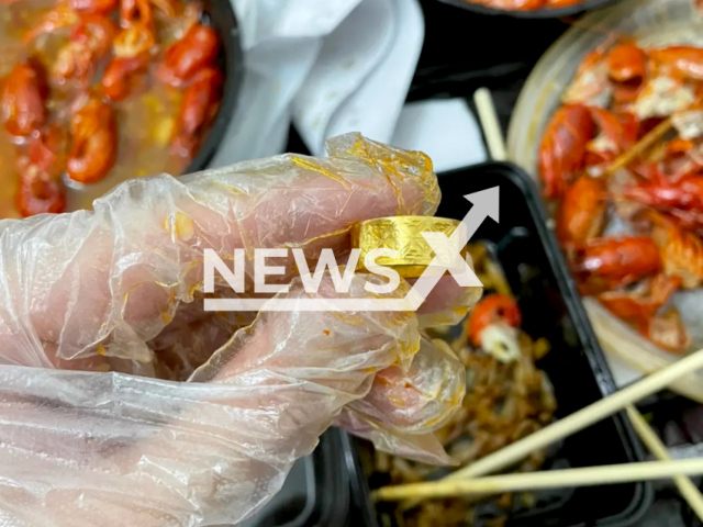 Man nearly eats gold ring found in takeaway food in Dongguan, China. Note: Private photo. (cen3556891/AsiaWire)