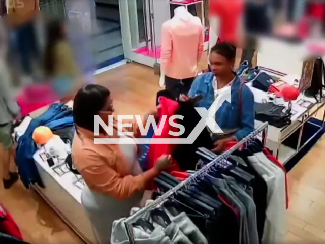 CCTV caught a woman stealing an expensive jacket, after she lifted up her dress and put the jacket between her legs, in Santos, Sao Paulo in Brazil in June 2022. Note: This picture is a screenshot from the video (Newsflash).