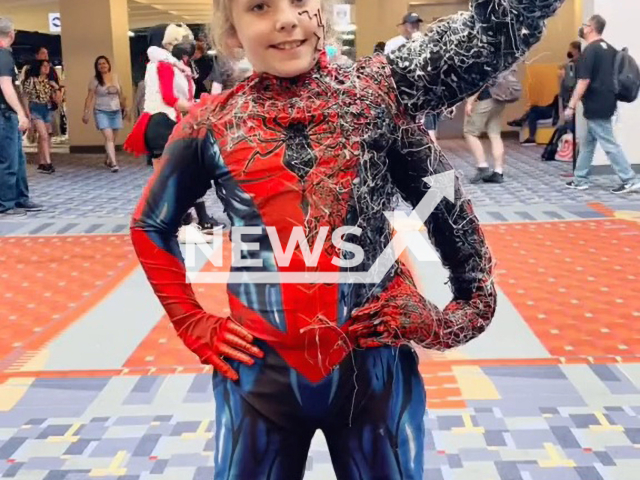 Spideykid displaying his one of a kind Marvel Spiderman/Venom cosplay costume, in Philadelphia. Note: Picture is a screenshot from a video (@spidey_mom/Newsflash)